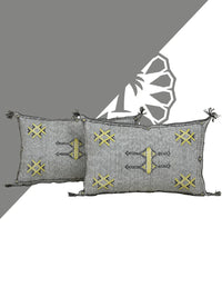 Handwoven Moroccan pillow with colorful Berber patterns