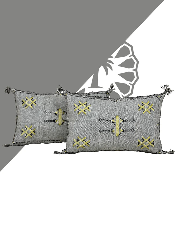 Handwoven Moroccan pillow with colorful Berber patterns