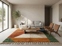 Plush, made-to-order Moroccan shag rug situated under a king-sized bed in a neutral bedroom, adding texture and warmth with its rust and beige geometric design.