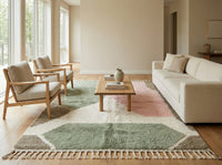 Large custom Beni Ourain area rug in a modern bohemian living room, anchoring a cream sofa with its soft pastel geometric design.