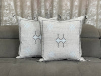 Grey Moroccan pillow in minimalist interior