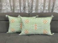 green Handwoven Moroccan pillow with colorful Berber patterns