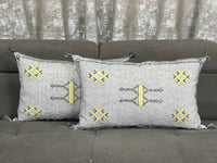 Handwoven Moroccan pillow with colorful Berber patterns