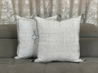 Grey Moroccan pillow in minimalist interior