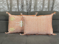 orange Handwoven Moroccan pillow with colorful Berber patterns