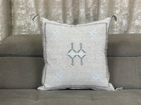 Grey Moroccan pillow in minimalist interior