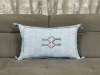 Blue Handwoven Moroccan pillow with colorful Berber patterns