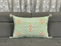 green Handwoven Moroccan pillow with colorful Berber patterns