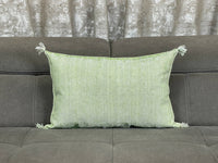 green Handwoven Moroccan pillow with colorful Berber patterns
