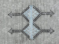 Grey Moroccan pillow in minimalist interior