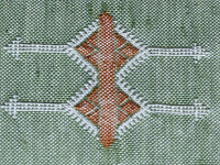 green Handwoven Moroccan pillow with colorful Berber patterns