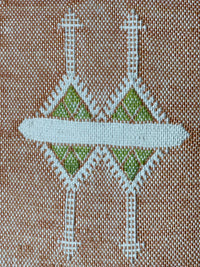 orange Handwoven Moroccan pillow with white Berber patterns