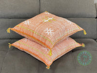 orange Moroccan pillow in minimalist interior