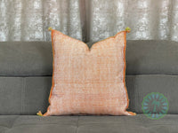 orange Moroccan pillow in minimalist interior