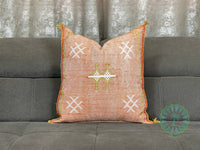 orange Moroccan pillow in minimalist interior