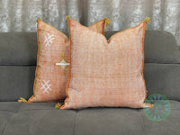 orange Moroccan pillow in minimalist interior