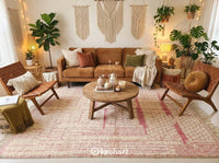 Plush Cream and Pink Beni Ourain Area Rug Under a King Size Bed in a Cozy Minimalist Master Bedroom Setting