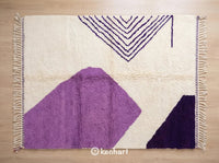 Custom made Beni Ourain Moroccan wool rug featuring deep viola, violet indigo, and dark blackberry geometric diamond patterns with a plush shaggy texture and traditional fringe.